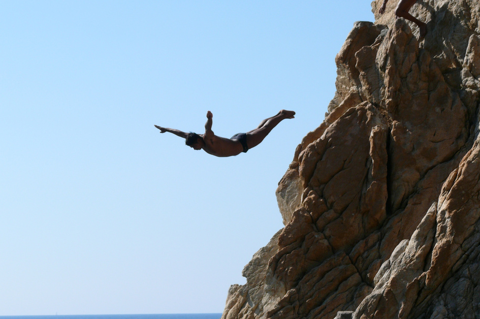 Swimmer Jumping Off a Cliff
